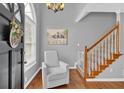 Bright and airy foyer with hardwood floors and a staircase at 127 Hyde Way, Dallas, GA 30157