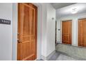 Hallway with hardwood doors and unit number displayed for easy identification at 3040 Peachtree Nw Rd, Atlanta, GA 30305
