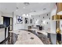 Bright lobby area with marble floors, designer furnishings, and unique wall decor at 3040 Peachtree Nw Rd, Atlanta, GA 30305