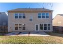 View of the rear exterior of the home showcasing its spacious backyard at 2496 Gristhaven Ln, Buford, GA 30519