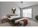 Bright bedroom featuring vaulted ceiling, neutral decor, and large window with natural light at 1126 Village Se Ct, Atlanta, GA 30316