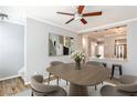 Open-concept dining area featuring hardwood floors, modern art, and a view into the kitchen at 1126 Village Se Ct, Atlanta, GA 30316