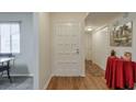 Bright entryway with wood floors, closet, and view into the dining area, ideal for welcoming guests at 2937 Torreya Way, Marietta, GA 30067