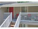 Welcoming porch with red door, seating area, and ample natural light at 2937 Torreya Way, Marietta, GA 30067
