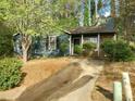 Charming one-story home with mature trees, inviting entrance, and a well-maintained front yard at 4952 Isle Royal Ct, Stone Mountain, GA 30088