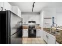 Well-equipped kitchen featuring modern appliances, tile flooring, and bright cabinetry at 821 Ralph Mcgill Ne Blvd # 3201, Atlanta, GA 30306
