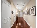 Inviting hallway featuring hardwood floors, recessed lighting, and decorative artwork at 2660 Peachtree Nw Rd # 14D, Atlanta, GA 30305