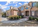 Charming brick home with elegant landscaping and inviting entrance, showcasing curb appeal at 2046 Chambord Way, Snellville, GA 30078