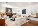 Sunlit living room showcasing modern furniture, stylish decor, and a fireplace at 2148 Palifox Ne Dr, Atlanta, GA 30307