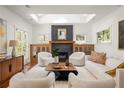 Bright living room featuring a fireplace, modern decor, and a skylight at 2148 Palifox Ne Dr, Atlanta, GA 30307