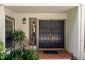 Elegant double front door with sidelight and outdoor seating at 3772 Paces Ferry West Se, Atlanta, GA 30339