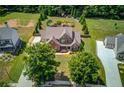 Expansive aerial view showcasing the home's mature landscaping and large lot in a serene setting at 1433 Henderson Ridge Ln, Loganville, GA 30052