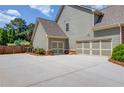 Spacious three-car garage with ample parking space and convenient side entry at 1433 Henderson Ridge Ln, Loganville, GA 30052