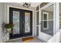 Inviting front entrance with elegant glass doors, creating a warm and welcoming first impression at 725 Dena Dr, Canton, GA 30114