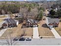 An aerial view of a lovely two-story brick home in a well-kept neighborhood at 9630 Carolina Drive, Jonesboro, GA 30238