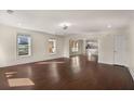 Spacious living room boasts beautiful hardwood floors and ample natural light at 1964 Hollywood Nw Rd, Atlanta, GA 30318