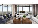 Bright living room with floor to ceiling windows, hardwood floors, and two white sofas with decorative pillows at 750 Park Ne Ave # 19E, Atlanta, GA 30326