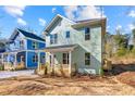 Two-story house with a classic design, featuring a front porch and modern landscaping at 1098 Wedgewood Nw Dr, Atlanta, GA 30318