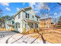 Charming home featuring a covered front porch, freshly planted landscaping and a freshly poured driveway at 1098 Wedgewood Nw Dr, Atlanta, GA 30318