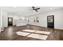 Bright living room features sleek hardwood floors, modern lighting, and an open-concept design at 1098 Wedgewood Nw Dr, Atlanta, GA 30318