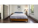 Bright bedroom with hardwood floors, a minimalist aesthetic, and ample natural light at 589 Broadview Ne Pl, Atlanta, GA 30324