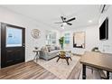 Inviting living room featuring a comfortable sofa, stylish decor, and lots of natural light at 1088 Wedgewood Nw Dr, Atlanta, GA 30318