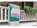 Sylvan Hills neighborhood sign adorns porch; hanging planter adds curb appeal to this Circa 1920 home at 942 Byron Sw Dr, Atlanta, GA 30310