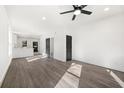 Bright and modern living room with wood floors, recessed lighting, and a ceiling fan for comfortable living at 1106A Wedgewood Nw Dr, Atlanta, GA 30318