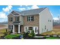Two-story home with landscaping and a Sales Center for information at 5429 Flat Rock Point, Stonecrest, GA 30038
