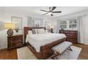 Spacious main bedroom featuring hardwood floors, natural light, and stylish furnishings at 3597 Embry Cir, Atlanta, GA 30341