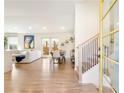 Bright, modern living room with hardwood floors, white walls, and a staircase at 196 Montgomery Ne St, Marietta, GA 30060