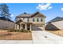 Attractive home with brick and siding exterior, complemented by a green lawn and driveway at 3596 Maple Hill Rd, Lithonia, GA 30038