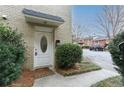 Exterior shot of an entry door featuring an oval glass window and classic brick surround at 869 Briarcliff Ne Rd # B25, Atlanta, GA 30306