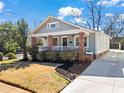 Charming craftsman style home with a cozy front porch and manicured landscaping at 949 Park Se Ave, Atlanta, GA 30315