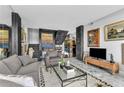 Open-concept living area featuring marble floors, comfortable seating, and unique architectural elements at 145 15Th Ne St # 409, Atlanta, GA 30309