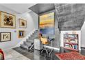 Unique staircase area with modern art, a cozy workspace, and a stylish mix of textures and decor at 145 15 Ne St # 409, Atlanta, GA 30309