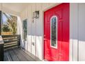 Close-up of a bright red front door with decorative window and modern address numbers at 200 Adeline Nw Ave, Atlanta, GA 30314