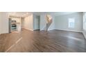 Bright living room featuring hardwood floors and an open layout with a view into the kitchen at 200 Adeline Nw Ave, Atlanta, GA 30314