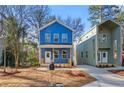 A modern home with a blue exterior and well-manicured landscaping at 2664 Brown Nw St, Atlanta, GA 30318