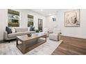 Bright living room with neutral decor, a modern sofa, and a decorative wood coffee table at 2664 Brown Nw St, Atlanta, GA 30318