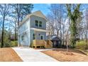 Charming two-story home with a light blue exterior, complemented by a well-maintained front yard at 2680 Brown Nw St, Atlanta, GA 30318