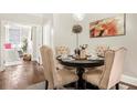 Chic dining area with seating for four and view into living room and bedroom at 2840 Peachtree Nw Rd # 301, Atlanta, GA 30305
