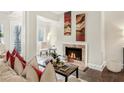 Bright living room featuring a fireplace, hardwood flooring, and neutral paint at 2840 Peachtree Nw Rd # 301, Atlanta, GA 30305