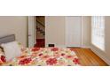 Cozy bedroom with hardwood floors, a large window, and a closet, providing a comfortable retreat at 4995 Greentree Trl, College Park, GA 30349