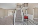 Inviting entryway with hardwood floors, staircase with white railings, and views to other rooms at 81 Sheffield Ln, Powder Springs, GA 30127