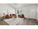 Spacious living room with a ceiling fan and luxury vinyl plank flooring at 1246 Bell Ave, East Point, GA 30344