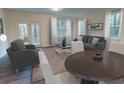 Inviting living room with neutral tones, plush seating, large windows, and stylish decor, offering a cozy atmosphere at 2003 Ayla Dr, Douglasville, GA 30135