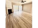 Spacious living room featuring a fireplace, wood-look floors and sliding glass doors at 51 Highoak Ne Dr # 12, Marietta, GA 30066