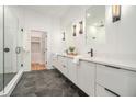 Modern bathroom boasts a double vanity, sleek fixtures, and a walk-in glass shower at 1099 Hawthorne Ne St, Atlanta, GA 30307