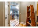 Entryway featuring hardwood floors and an open view to the kitchen and dining area at 825 Highland Ln # 1105, Atlanta, GA 30306